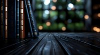 Row of vintage books on dark wooden surface with soft bokeh lights in background creating cozy atmosphere for reading and relaxation. Perfect for literature themes.