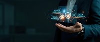 Businessman holding glowing digital icons representing service excellence, quality assurance, and data security in palm of hand against dark background for business solutions.