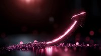 Glowing pink arrow rises upward against dark background with scattered luminous particles and bokeh effects creating magical atmosphere for business success concept.