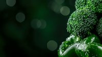 Fresh green broccoli florets and water drops on dark background with bokeh lights, macro food photography for healthy eating and nutrition concepts.