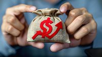 Hands holding burlap money bag with red dollar symbol and upward arrow, representing financial growth, investment returns and wealth accumulation.