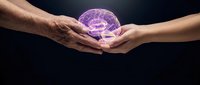 Two hands gently holding glowing purple brain representing mental health support, neuroscience research, and intergenerational knowledge transfer.