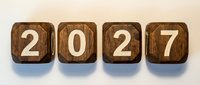 Wooden blocks displaying 2027 numbers arranged in row on neutral background for calendar and time concepts.
