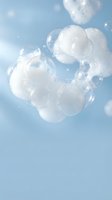 Cluster of translucent soap bubbles floating against soft blue sky with bokeh light effects, ideal for skincare, wellness, and cosmetic product marketing campaigns.