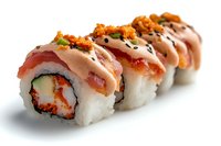 Fresh sushi rolls topped with salmon, spicy mayo sauce, tobiko roe and black sesame seeds on white background, macro food photography.