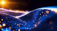 Abstract digital wave pattern with glowing blue particles and golden light effects against dark background, featuring dynamic motion and bokeh elements.