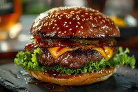Juicy beef burger with melted cheddar cheese, crispy bacon, fresh lettuce on sesame seed bun, close-up shot showing layers of toppings and glistening meat patty.