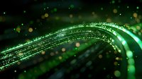 Glowing green light trails with sparkling particles and bokeh effects create dynamic motion against dark background. Abstract design for technology concepts.