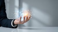 Businessman hand holding glowing digital brain with network connections and light particles for artificial intelligence and technology concepts.