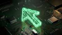 Glowing green digital arrow on computer circuit board representing technology advancement, data transfer, and electronic innovation in modern computing systems.