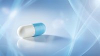 Blue and white medical capsule pill on reflective surface with soft blue light rays background for healthcare and pharmaceutical concepts.