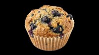 Blueberry muffin with paper wrapper isolated on transparent background, ready for bakery designs, menus, recipe blogs, print-on-demand products, and food packaging graphics.