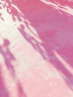 Abstract pink background with natural palm leaf shadows creating diagonal lines and organic patterns on textured surface. Soft dreamy aesthetic for modern design.
