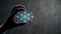 Hands protecting glowing network of connected icons representing digital technology, cybersecurity, data protection and innovation in modern business environment.