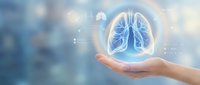 Hand holding glowing lungs hologram for respiratory health medical care and pulmonology concept on blurred healthcare background.