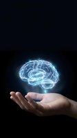 Glowing digital brain hologram floating above open palm against dark background representing artificial intelligence and mental health concepts.
