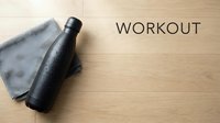 Flat lay composition featuring black insulated water bottle and gray towel on wooden surface with workout text, suitable for fitness, wellness, and sports marketing materials.