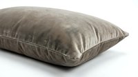 Soft taupe velvet cushion with plush texture on white background, showcasing luxury home decor and interior design comfort.