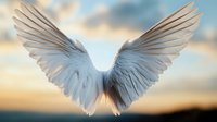 White angel wings spread against golden sunset sky, dramatic lighting creates ethereal atmosphere. Spiritual and religious concept for faith-based designs.