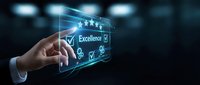 Businessman hand touching digital interface displaying excellence rating with stars and checkmarks on dark background.