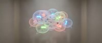 Translucent spheres with glowing neon particles floating in neutral space, suitable for tech, innovation, and digital design projects.