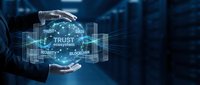 Businessman hands protecting digital trust ecosystem with glowing security network icons in futuristic blue technology environment for cybersecurity concepts.