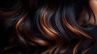 Luxurious dark hair with copper balayage highlights flowing in waves against black background, with glowing particles creating magical atmosphere for beauty salon.