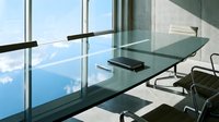 Modern office workspace with glass desk and panoramic mountain views through floor-to-ceiling windows, featuring contemporary furniture and minimalist design for corporate, business, and professional environments.