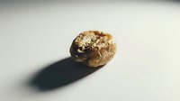Cracked walnut shell with intricate natural texture and shadow on neutral background for food photography and healthy eating concepts.