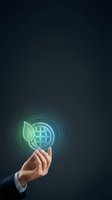 Businessman hand holding glowing green leaf and globe icon, symbolizing sustainable business, eco innovation and environmental responsibility.