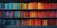 Colorful books arranged in rainbow spectrum order on wooden shelves creating gradient effect from blue through yellow to red tones. Library collection background.