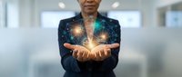 Professional businesswoman in dark suit holding glowing digital network connections and data points in cupped hands representing technology innovation and connectivity.