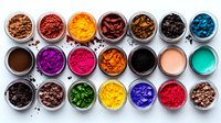 Colorful makeup pigments and mineral powders in round transparent jars arranged in rows on white background, showing vibrant cosmetic ingredients.