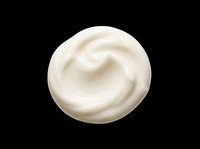 Creamy white swirl of face cream or moisturizer isolated on transparent background, ready for beauty, skincare, cosmetic design, stickers, and print on demand use.