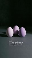 Three pastel purple Easter eggs on dark background with Easter text, moody minimal holiday composition for greeting cards.