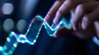Glowing blue financial chart line being touched by finger on dark background with bokeh lights, showing market data analysis and trading concept.