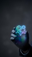 Hand holding glowing neon gears and network connection symbols against dark background, representing technology, innovation, and digital transformation for business solutions.