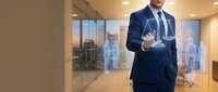 Professional businessman in navy suit touching holographic digital interface in modern office environment for technology and business innovation concepts.