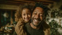 Happy African American father and mixed-race daughter embracing at home, showing love and family bonding in cozy living room with warm natural lighting.