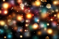 Magical bokeh lights on dark background with glowing golden and turquoise circles, sparkles and stars creating dreamy festive atmosphere.