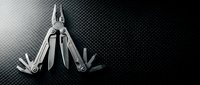 Multi-tool with extended blades and tools displayed on dark textured background, suitable for camping, survival, outdoor activities, DIY projects, and equipment promotional materials.