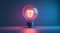 Glowing incandescent light bulb with warm filament against cool blue and pink gradient background, symbolizing innovation, creativity, and bright ideas for design projects.