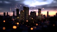 Modern cityscape silhouette at dusk with glowing windows and bokeh light effects against dramatic sunset sky, creating atmospheric urban nighttime ambiance.
