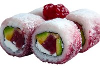 Fresh sushi rolls with tuna, avocado and cream cheese topped with raspberry powder coating and garnished with fresh raspberry, macro food photography.