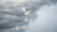 Dramatic cloudy sky with soft sunlight breaking through gray storm clouds creating atmospheric lighting and moody weather conditions.