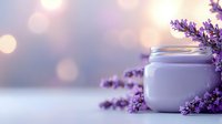 Fresh lavender cosmetic cream jar with purple flowers and soft bokeh background creates relaxing spa atmosphere for wellness and beauty products.