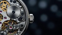 Luxury mechanical watch movement with exposed gears and jewels on dark background. Precision timepiece craftsmanship and horological engineering detail.