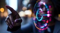 Futuristic interface concept with human hand touching holographic circular display, glowing neon elements against blurred city lights background.