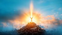 Silhouette of person standing on mountain peak with arms raised against dramatic sunset sky and light beam, representing success, faith and achievement.