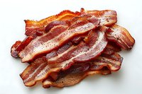 Crispy fried bacon strips with perfect golden-brown edges and rich marbling, arranged in a rustic stack on white background, ideal for food photography and menu design.